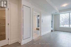 Ottawa condo for rent - A spacious room with a sliding door and a large window.