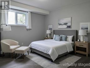 Aylmer apartment for rent - A bedroom with a bed, chair, and nightstand.