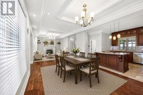 Toronto (Humber Heights) apartment for rent - A dining room with a table set for six with a chandelier above.