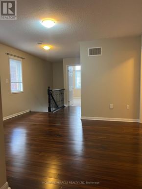 Milton (Co Coates) apartment for rent - A room with wooden floors and a window.