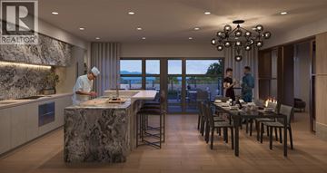 Richmond apartment for rent - A modern kitchen with a marble island and a dining table set for two.