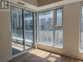 Toronto (South Riverdale) condo for rent - A room with a sliding glass door leading to a balcony.