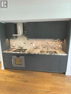 Toronto (Annex) condo for rent - A kitchen with a marble countertop and a built-in oven.