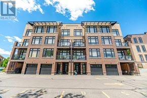 Vaughan (West Woodbridge) townhouse for rent - A multi-story brick building with a clear blue sky above.