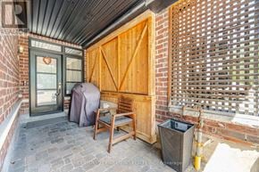 Vaughan (West Woodbridge) townhouse for rent - A wooden door is open to a covered patio.