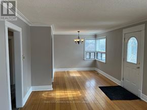 Mississauga (Lakeview) apartment for rent - A room with wooden floors and white walls.