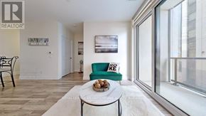 Vaughan (Concord) condo for rent - A living room with a green chair and a coffee table.