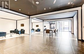 Toronto (Bay Street Corridor) condo for rent - A spacious living room with a dining area and a kitchen in the background.