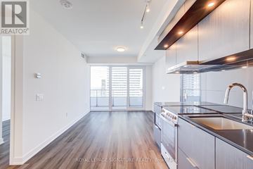 Mississauga (City Centre) condo for rent - A well-lit kitchen with a sink and a window.