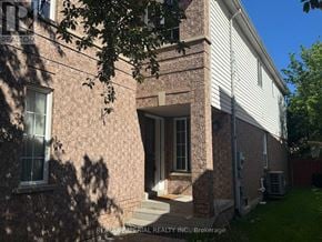 Newmarket (Stonehaven-Wyndham) apartment for rent - A house with a brick facade and a white door is for sale.