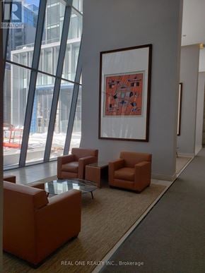 Toronto (Church-Yonge Corridor) condo for rent - A large framed picture hangs on a wall above a table and chairs in a room.