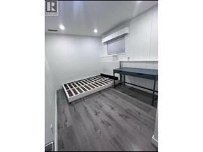 Burnaby apartment for rent - A room with a grey floor and a white wall with a window.