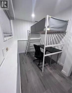 Burnaby apartment for rent - A small room with a bunk bed and a desk.