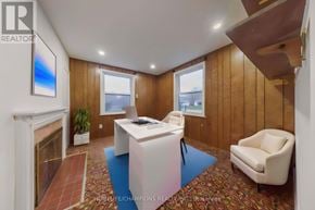 Toronto (Agincourt South-Malvern West) apartment for rent - A realtor's office with a fireplace and a painting on the wall.