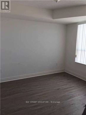 Toronto (Bendale) condo for rent - A room with a wooden floor and a window with blinds.