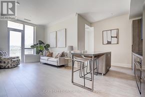 Markham (Unionville) condo for rent - A spacious living room with a dining table and chairs.