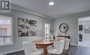 Clarington (Bowmanville) apartment for rent - A dining room with a wooden table and chairs.