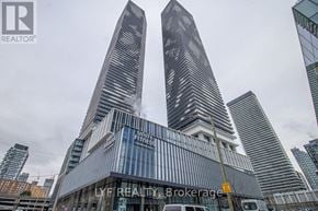 Toronto (Waterfront Communities) condo for rent - A tall building with the words "LYF REALTY Brokerage" on it.
