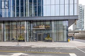 Toronto (Waterfront Communities) condo for rent - A modern building with the number 138 on it.