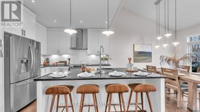 London North (North M) apartment for rent - A modern kitchen with a large island and bar stools.