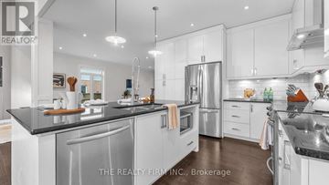 London North (North M) apartment for rent - A modern kitchen with white cabinets and stainless steel appliances.