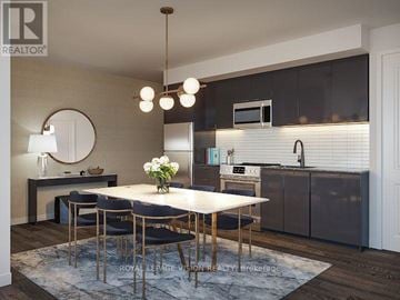 Toronto (Humber Heights) condo for rent - A modern kitchen with a dining table set for four.