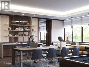 Toronto (Humber Heights) condo for rent - A woman is working on her laptop in a modern office setting.