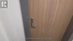 Vaughan (Vellore Village) condo for rent - A door with a handle and a lock is closed.