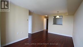 Toronto (Agincourt North) condo for rent - A large, empty room with wood flooring and white walls.