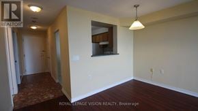 Toronto (Agincourt North) condo for rent - A room with a wooden floor and a mirror on the wall.