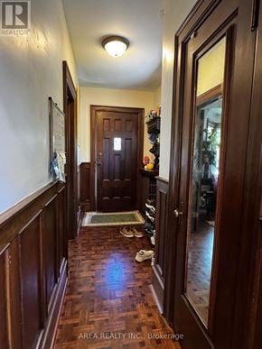 Toronto (Humewood-Cedarvale) apartment for rent - A hallway with a wooden floor and a brown door.