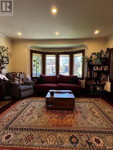 Toronto (Humewood-Cedarvale) apartment for rent - A living room with a red couch and a rug.