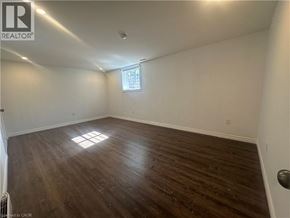Hamilton apartment for rent - A room with wooden flooring and a window.