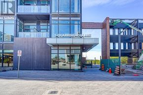 Toronto (Banbury-Don Mills) condo for rent - A building with a glass facade and a sign that reads "5 QUARRINGTON LANE".