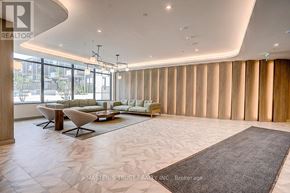 Toronto (Banbury-Don Mills) condo for rent - A spacious living room with a large window and a view of the city.