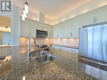 Whitchurch-Stouffville (Stouffville) condo for rent - A kitchen with granite countertops and stainless steel appliances.