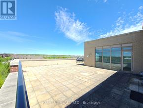 Whitchurch-Stouffville (Stouffville) condo for rent - A rooftop with a glass door and a brick wall.