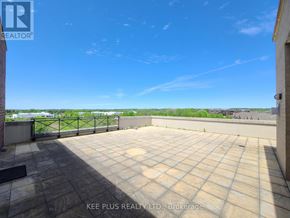 Whitchurch-Stouffville (Stouffville) condo for rent - A rooftop patio with a tiled floor and a metal railing.
