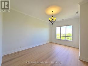 Whitchurch-Stouffville (Stouffville) condo for rent - A room with a chandelier and a window with a view of greenery outside.