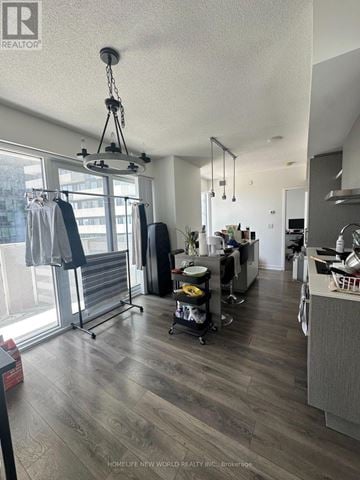Toronto (Waterfront Communities) condo for rent - A well-lit, modern kitchen with a dining area and a laundry room.