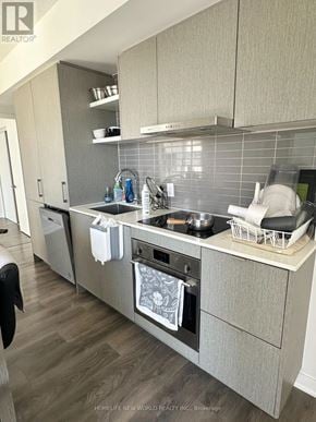Toronto (Waterfront Communities) condo for rent - A kitchen with a tile backsplash and a dishwasher.