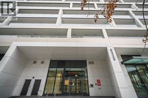 Richmond apartment for rent - The image shows the front of a building with a glass door and a sign that reads "320".