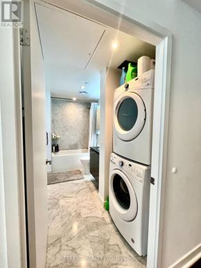 Toronto (Bayview Village) condo for rent - A white door with a washing machine in it.