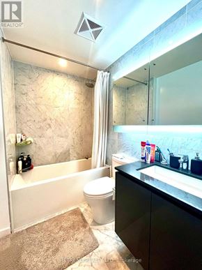 Toronto (Bayview Village) condo for rent - A bathroom with a toilet, sink, and bathtub.