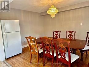 Markham (Middlefield) apartment for rent - A dining room with a wooden table and chairs.