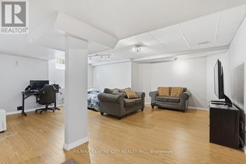 London East (East A) apartment for rent - A living room with a grey couch and a black piano.