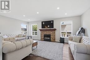 London East (East A) apartment for rent - A living room with a fireplace and a television.