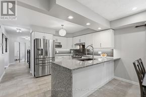 London East (East A) apartment for rent - A modern kitchen with a large island and stainless steel appliances.