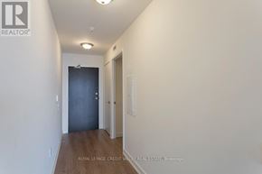 Toronto (Niagara) condo for rent - A hallway with a door on the left and a door on the right.