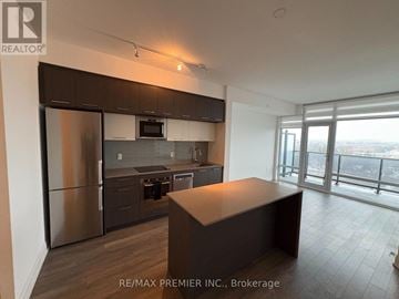 Vaughan (East Woodbridge) condo for rent - A kitchen with a refrigerator, microwave, oven, and dishwasher.